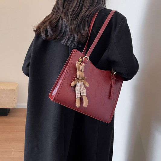 🎅Christmas Carnival Delivery🥳👜Women's Trendy Shoulder Bag with Doll Pendant